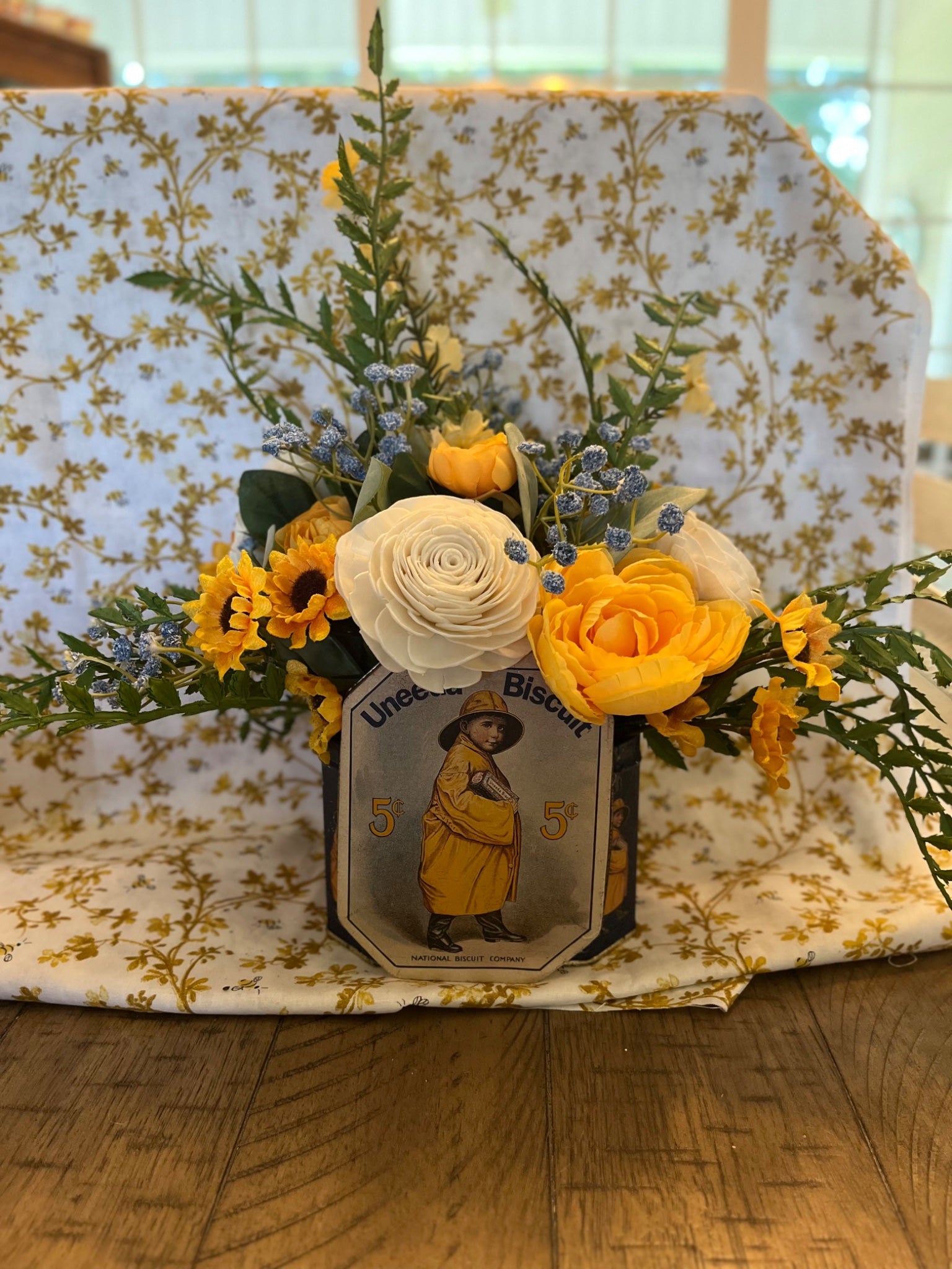 Vintage cracker tin floral arrangement  - 1