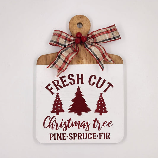 Fresh cut Christmas trees wooden cutting board - 1